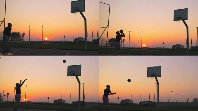 WS年轻人在日落时在室外篮球场打篮球