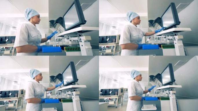 一名妇女使用现代实验室医疗设备慢动作。