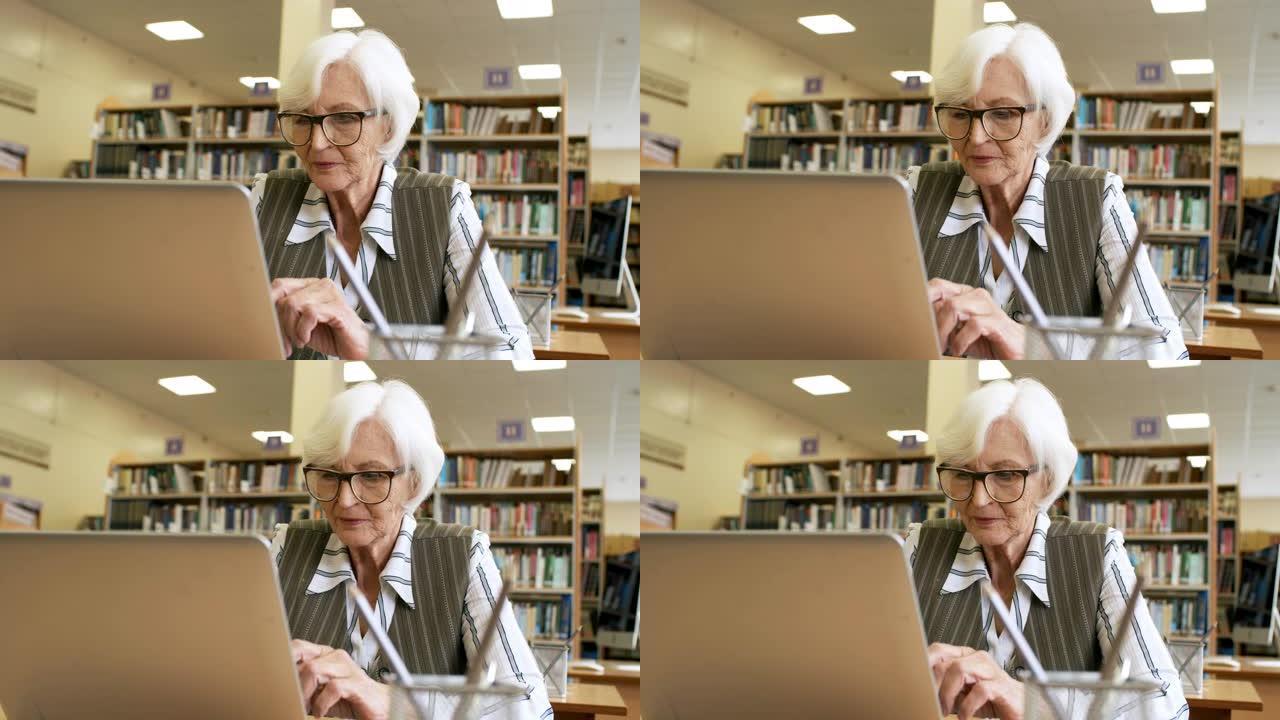 使用电脑的集中老年妇女
