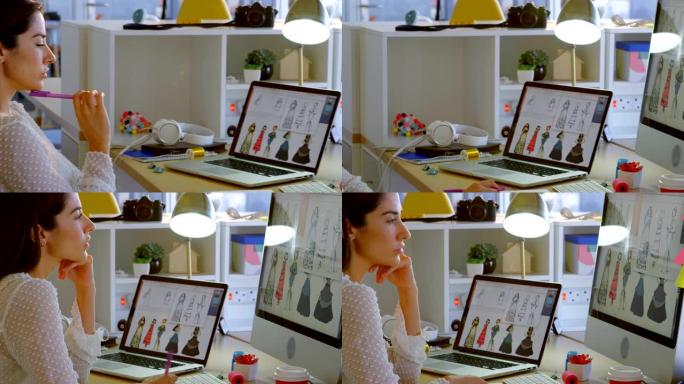 白人女性时装设计师在办公室4k办公桌上电脑工作的侧视图