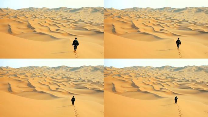 在沙漠中行走的人沙漠徒步背影沙漠风光荒漠