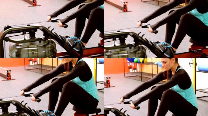 女子在4k健身室用划船机锻炼