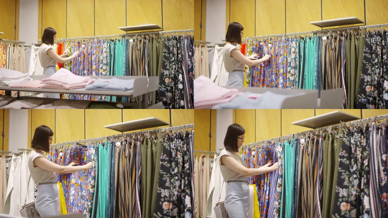 亚洲女性在商店里浏览衣服