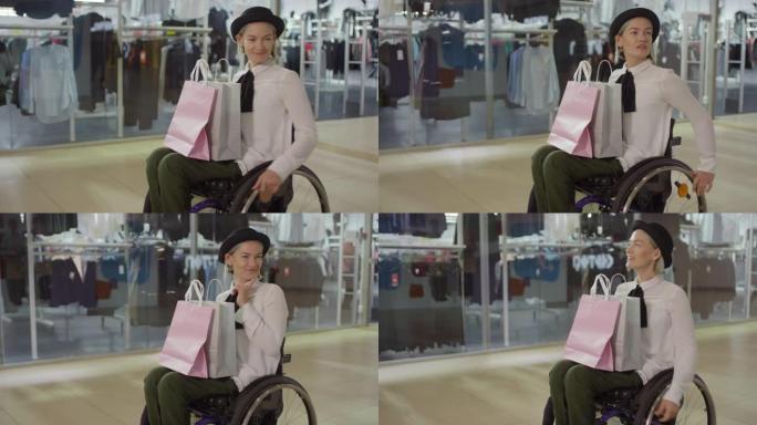 坐轮椅穿过购物中心的时尚截瘫妇女