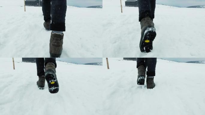 在雪地上行走。雪地行走雪地徒步雪地脚步特