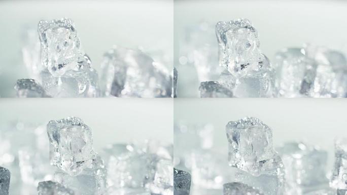在白色背景上慢动作融化的纯水冰块的宏观拍摄。