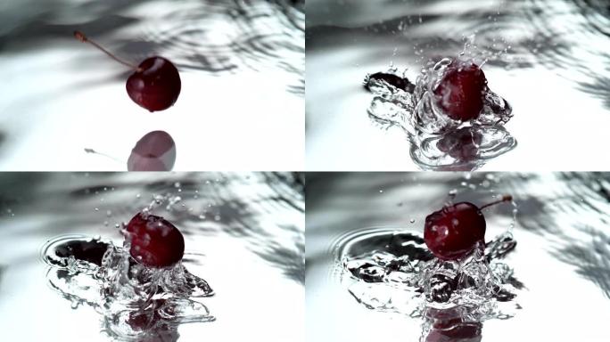成熟的樱桃落入水中。超级慢动作