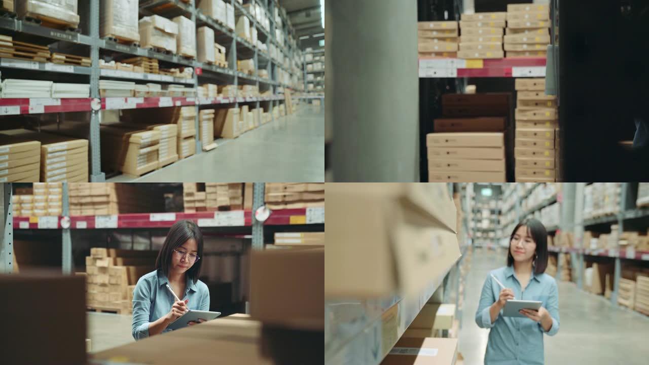 年轻的亚洲老板商人或工人正在仓库里用数字平板电脑走路和计数库存。女性企业家在仓库里计算库存。