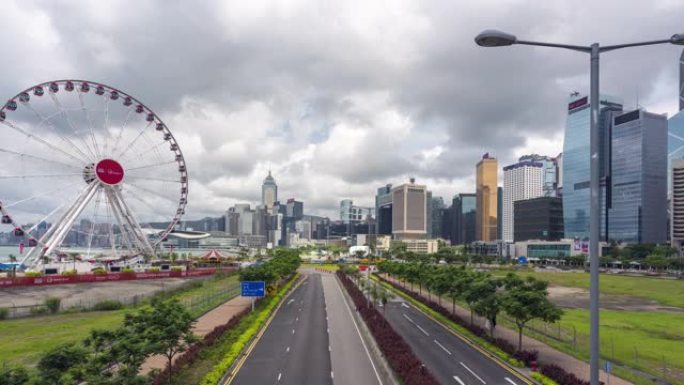 4K UHD延时: 香港中区的摩天轮和城市现代城市景观背景。