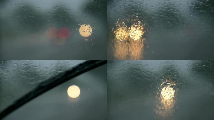 雨滴在汽车挡风玻璃和雨刷上。恶劣天气概念