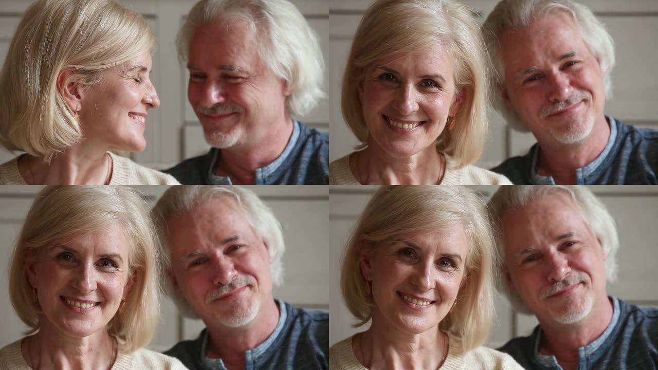 老年有魅力的夫妇退休家庭微笑着看着相机