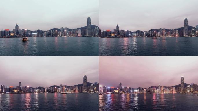 白天到晚上，香港的T/L ZO城市景观和黄昏的垃圾船