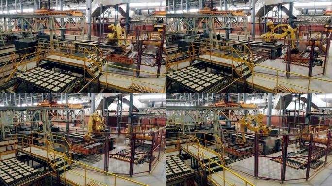 自动化的机器人工业综合体正在工厂周围移动砖块