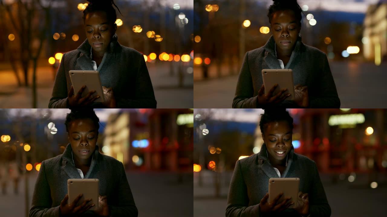 非洲妇女晚上用平板电脑