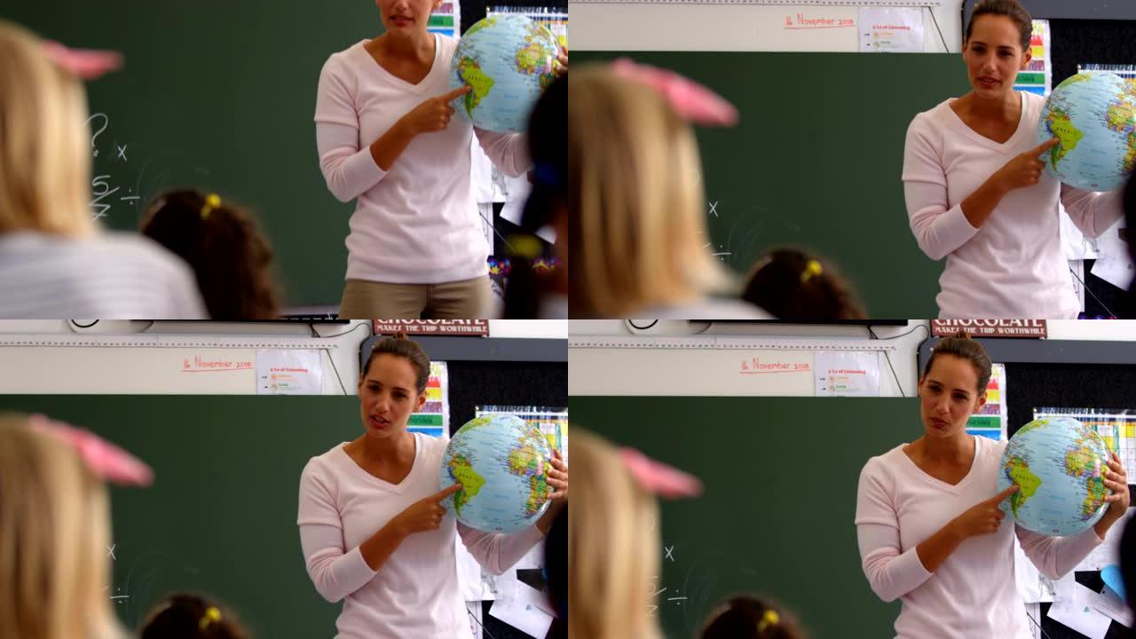 高加索女教师在4k教室讲解地球仪的前视图