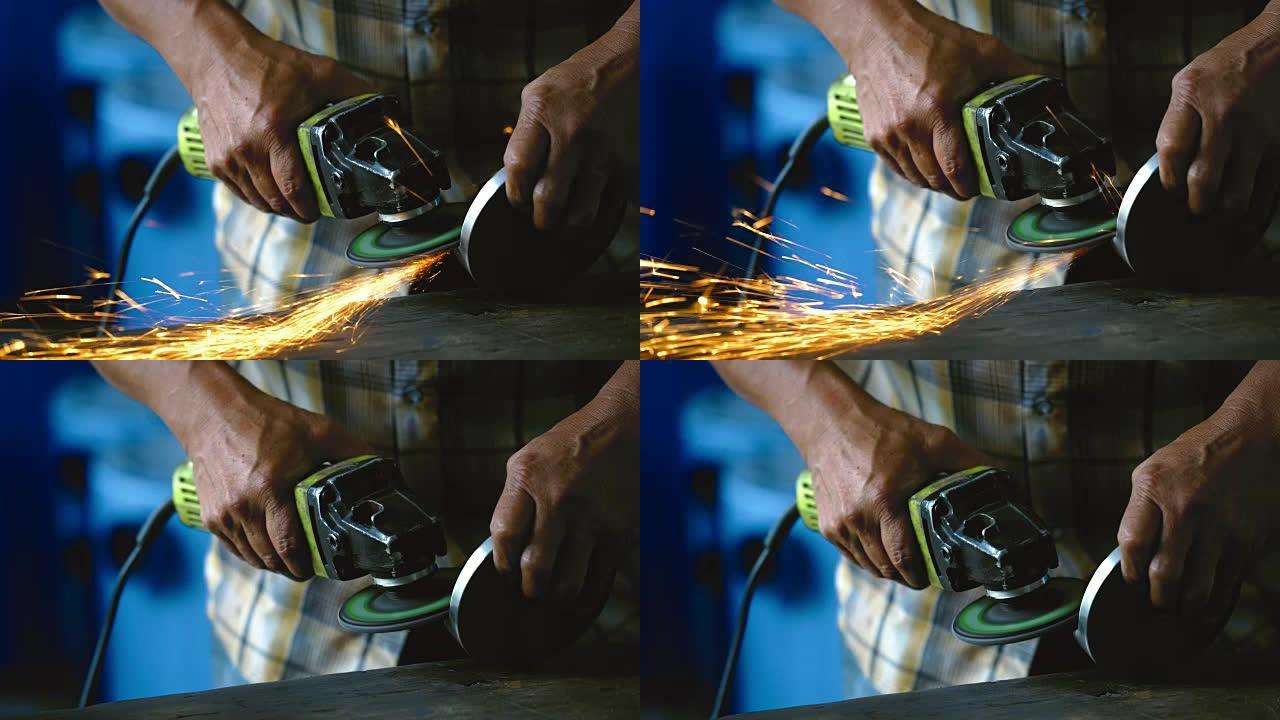 4k镜头场景角磨机的特写在金属工厂，工业和机器概念中手持和研磨木桌上的金属备件