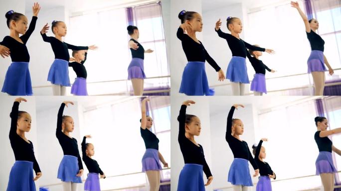 年轻的芭蕾舞演员在课堂上训练，特写镜头。