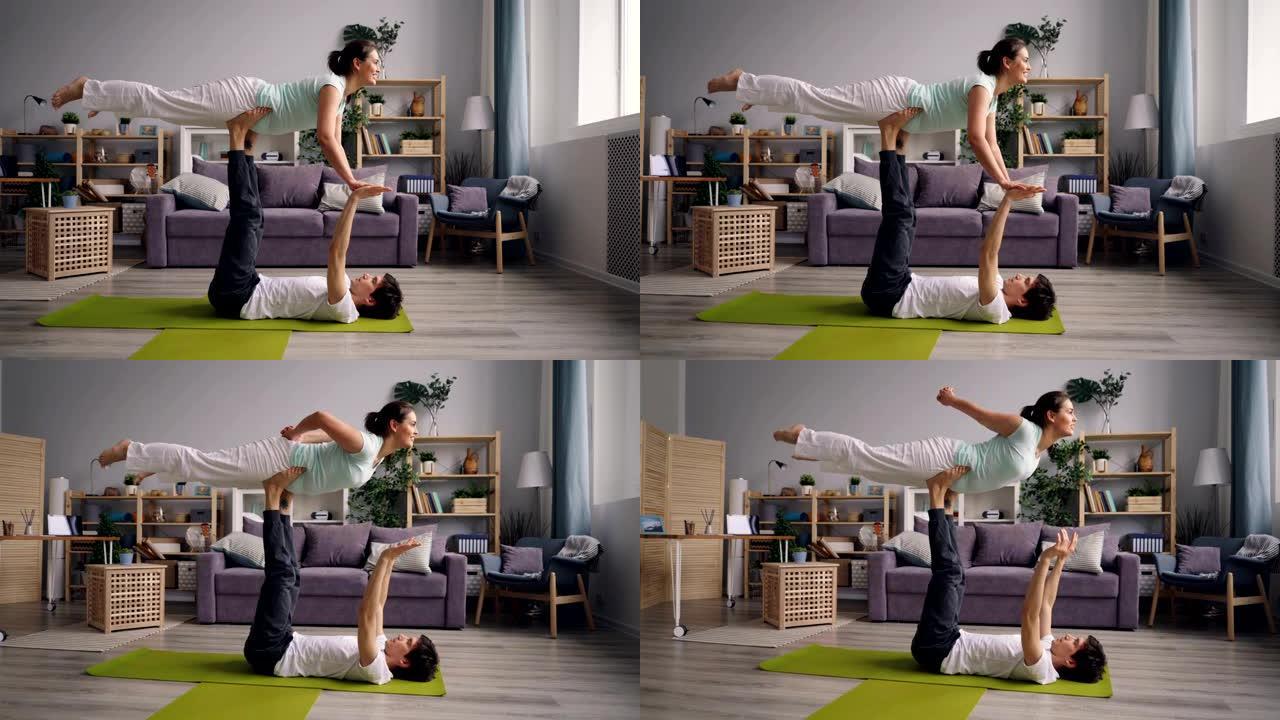 女孩和男孩一起练习瑜伽，让情侣一起做平衡运动