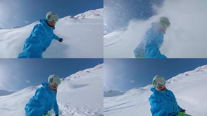 自拍照: 滑雪者在下山时用木板喷洒粉末雪