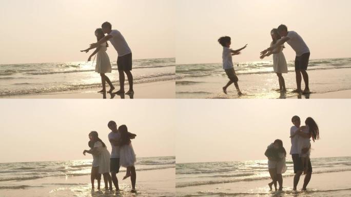 亚洲年轻快乐的家庭晚上在海滩上享受假期。4k慢动作。