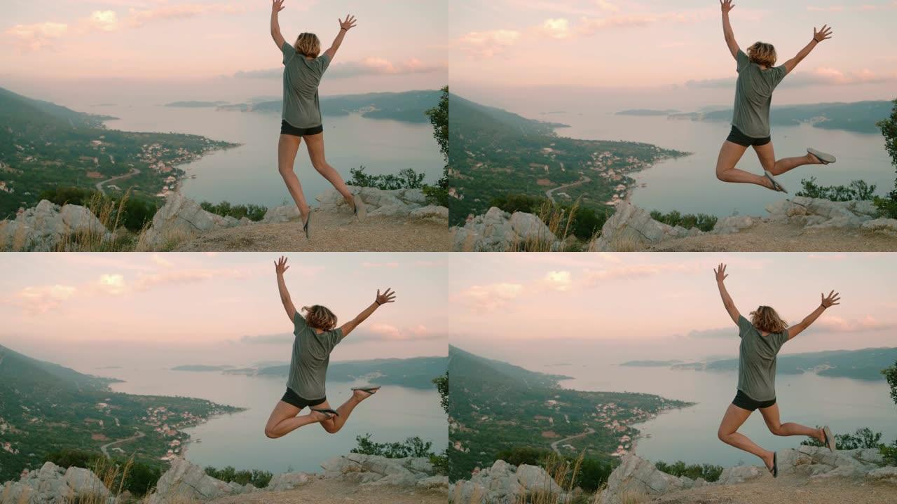 旺盛的女士在克罗地亚佩列萨克的风景秀丽的俯瞰处欢呼雀跃