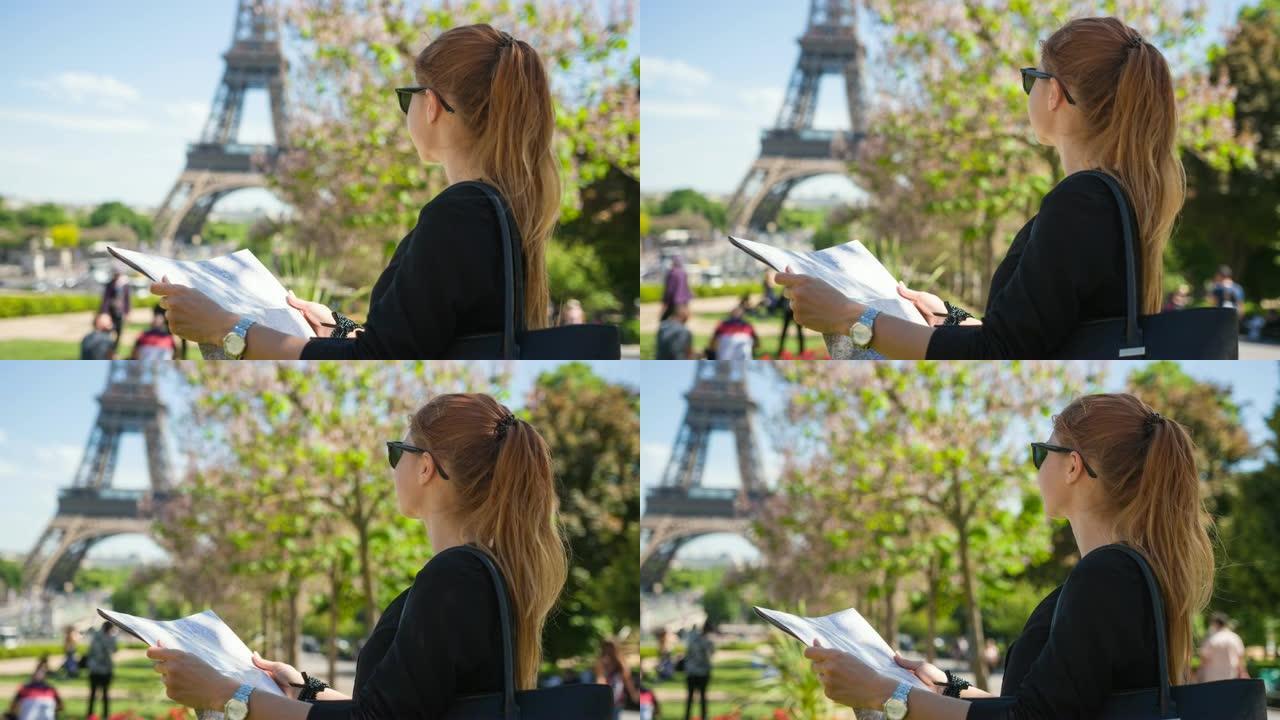女人在春天在巴黎度假，看着埃菲尔铁塔