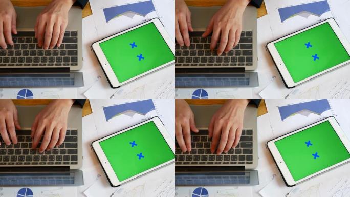 在会议室数字平板电脑上，数字桌上有绿色色度键屏幕