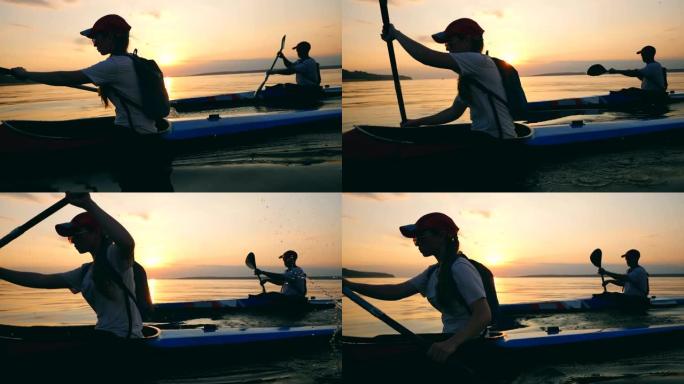 划船者在日落时划桨的侧视图