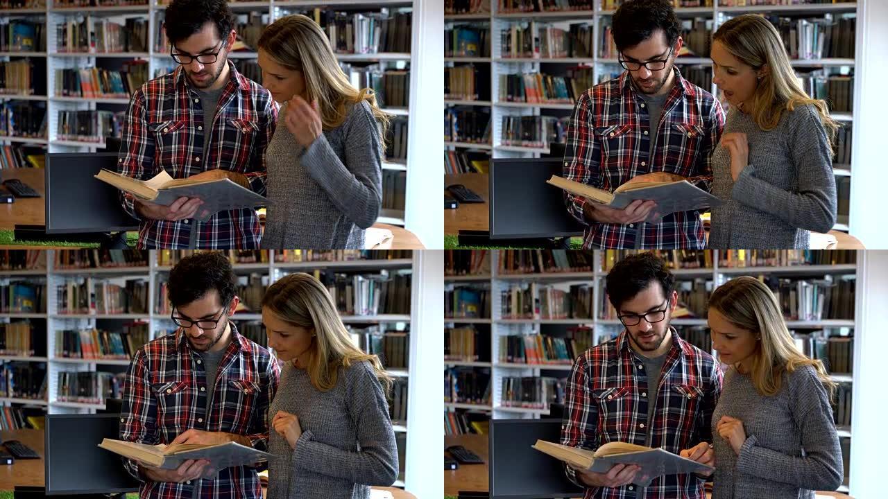 成年学生夫妇在图书馆看书和聊天进行研究