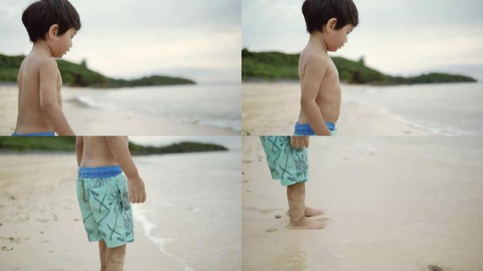 小男孩喜欢在海上玩沙子