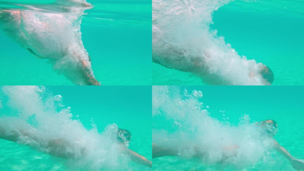 MS超级慢动作女人在水下潜入绿松石蓝色的海洋