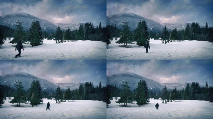 男子在降雪中走在山脉附近