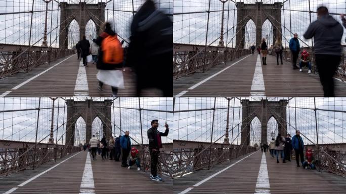 延时: 美国纽约布鲁克林大桥上的游客行人