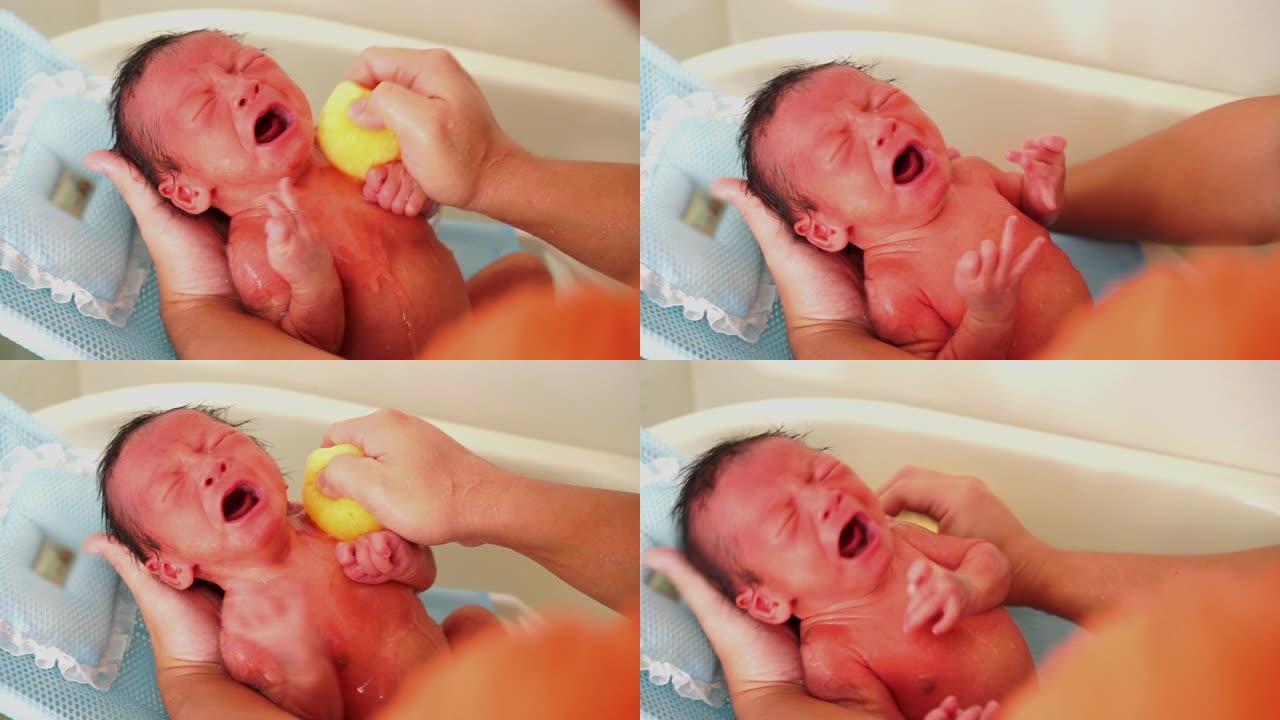 SLO MO亚洲男婴哭泣与母亲在浴缸浴室淋浴