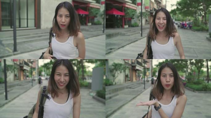 亚洲背包客女人在中国北京旅行感到快乐，开朗美丽的年轻少年博客女性在唐人街散步。生活方式背包旅游度假概