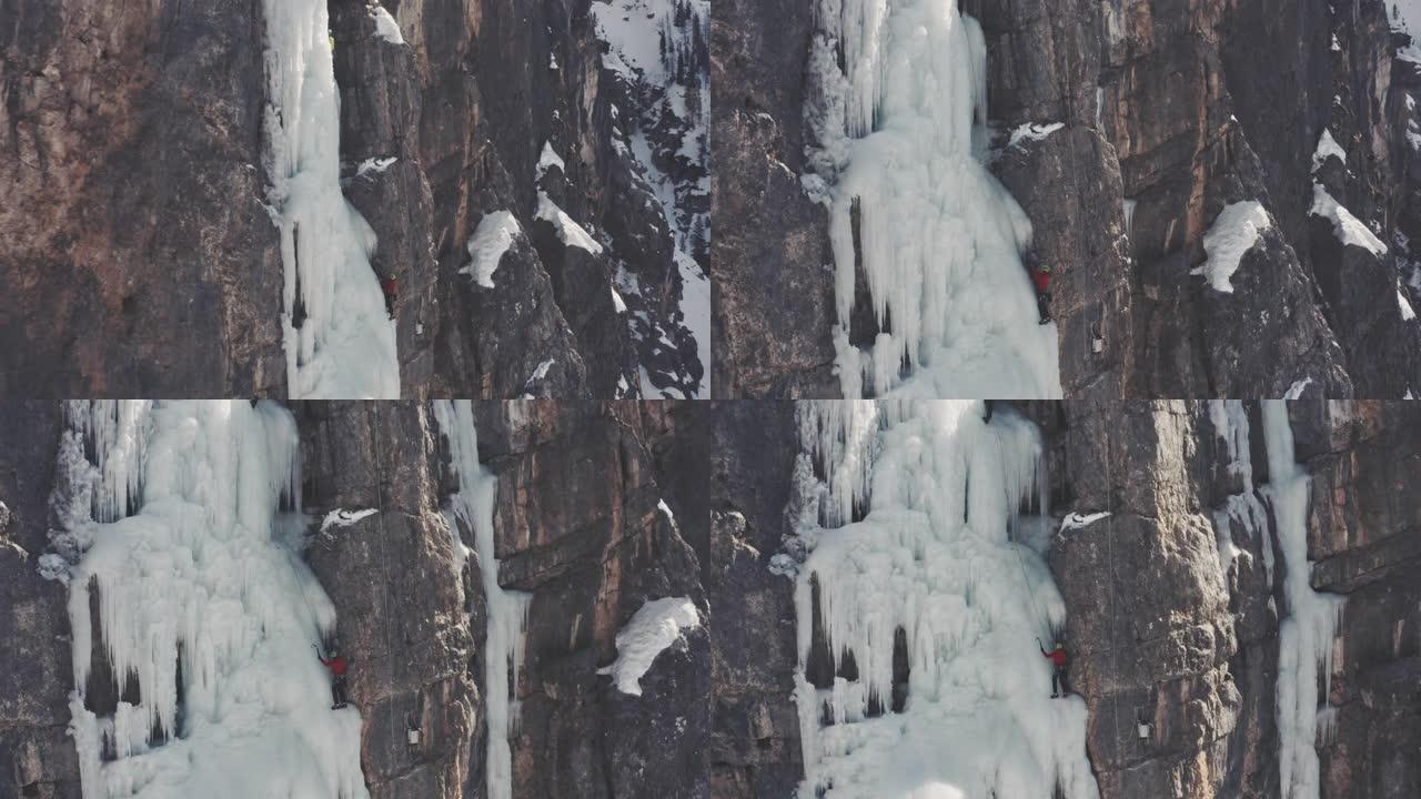 在瀑布上爬冰悬崖峭壁雪山悬崖攀岩