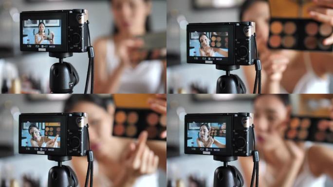 亚洲年轻女性博客作者在社交媒体概念上在家录制带有化妆化妆品的vlog视频在线影响者。实时流病毒