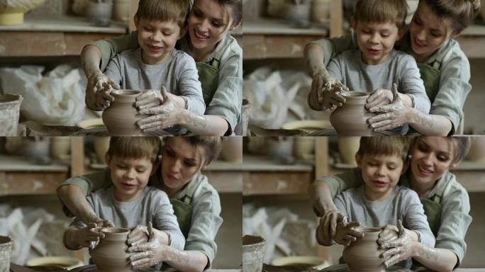 女人和男孩在陶轮上扔花瓶