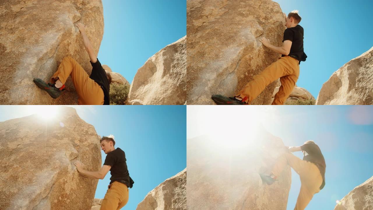 男子攀岩用镜头耀斑伸向外面的岩石