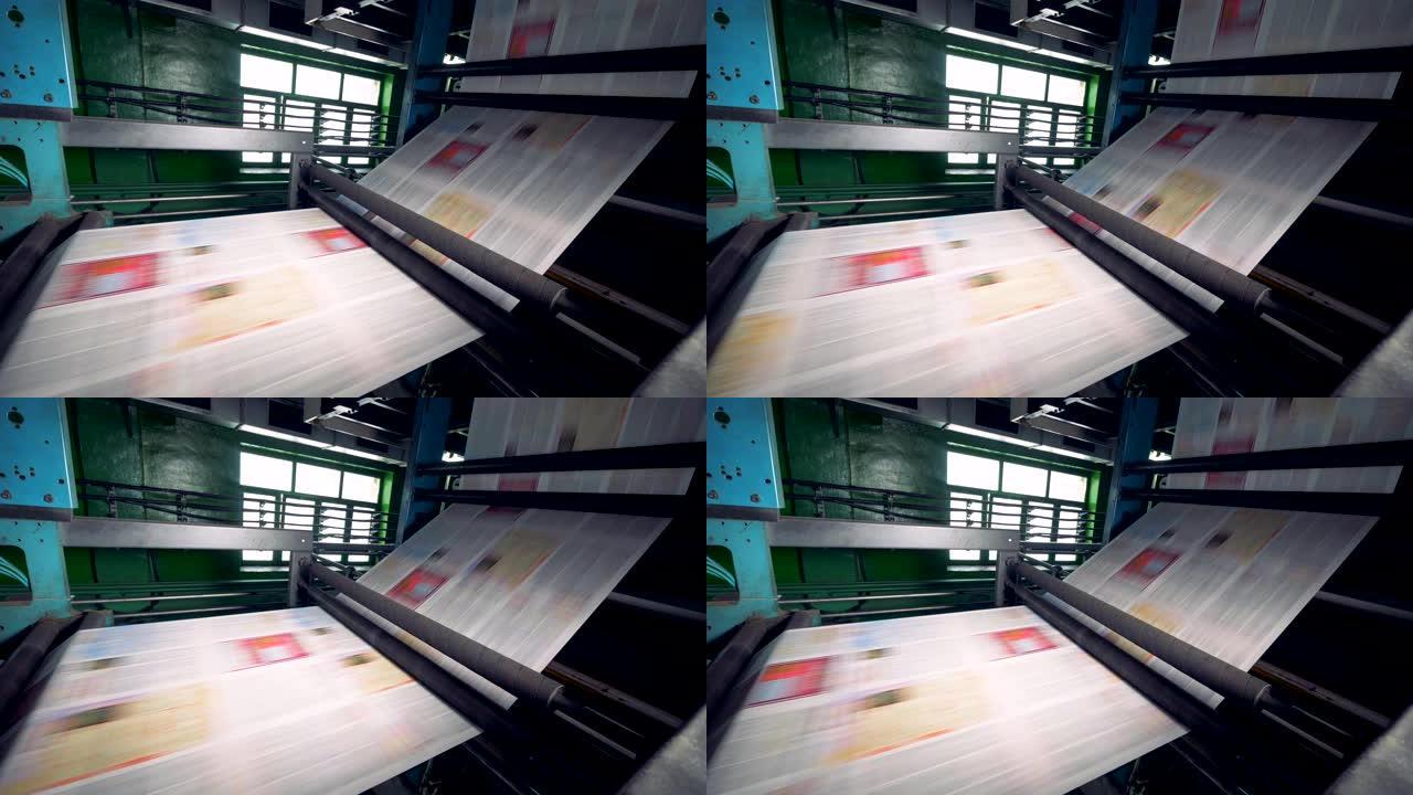 报纸印刷设备在工厂工作，关闭。