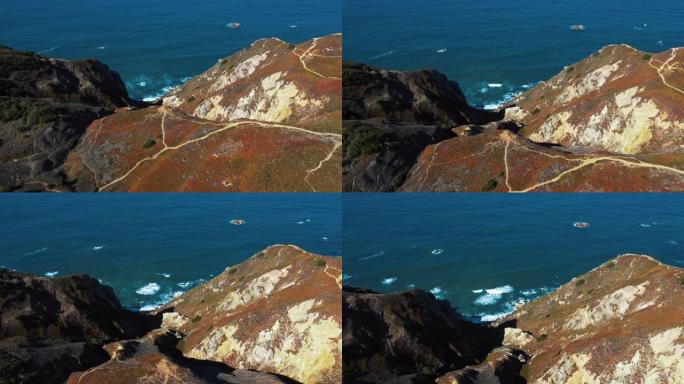 空中无人机镜头: 葡萄牙岩石海岸，海景优美。飞越葡萄牙，海岸线上有碧绿的海浪冲入岩石峭壁。Praia