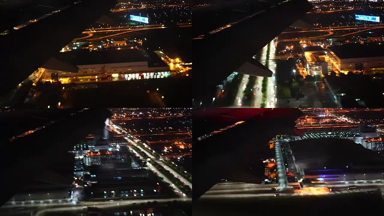 4k镜头飞机在晚上准备降落机场，旅行和运输概念之前在城市上空飞行的场景