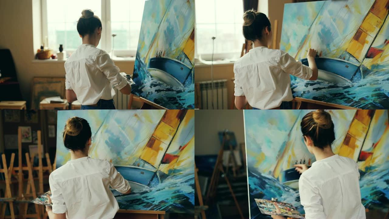 专业女画家正在使用油画和调色板刀在画布上创作美丽的海景。绘画技术和工具概念。