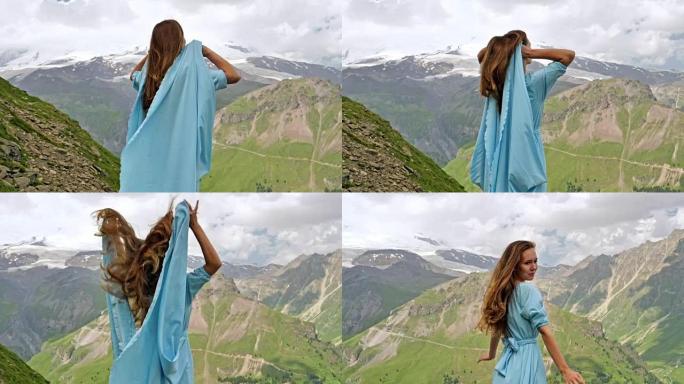 穿着优雅礼服的女人在山里摆姿势