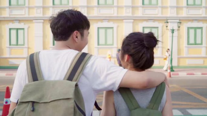 慢动作-旅行者亚洲夫妇在泰国曼谷旅行和散步，甜蜜的夫妇在假日旅行中度过甜蜜的时光感到快乐。生活方式夫
