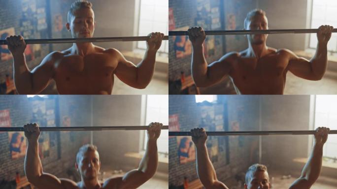 在铁杆健身房做引体向上的赤膊男子。华丽的职业运动员做下巴力量，力量和健身房锻炼和日常锻炼。高架射击