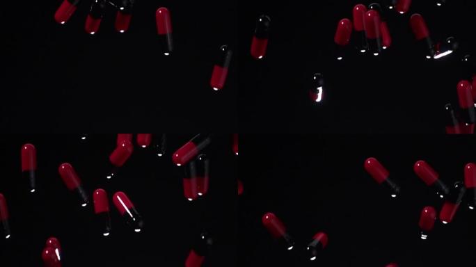 超级慢动作: 红色和黑色胶囊落在黑色背景上