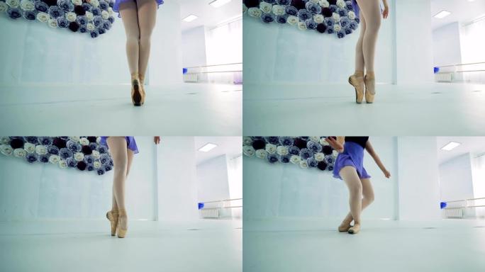 一个芭蕾舞演员踮着脚站着，特写镜头。