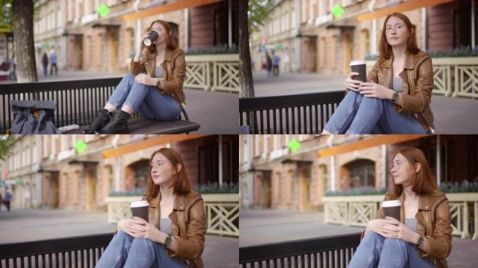 时髦女孩在长凳上喝咖啡
