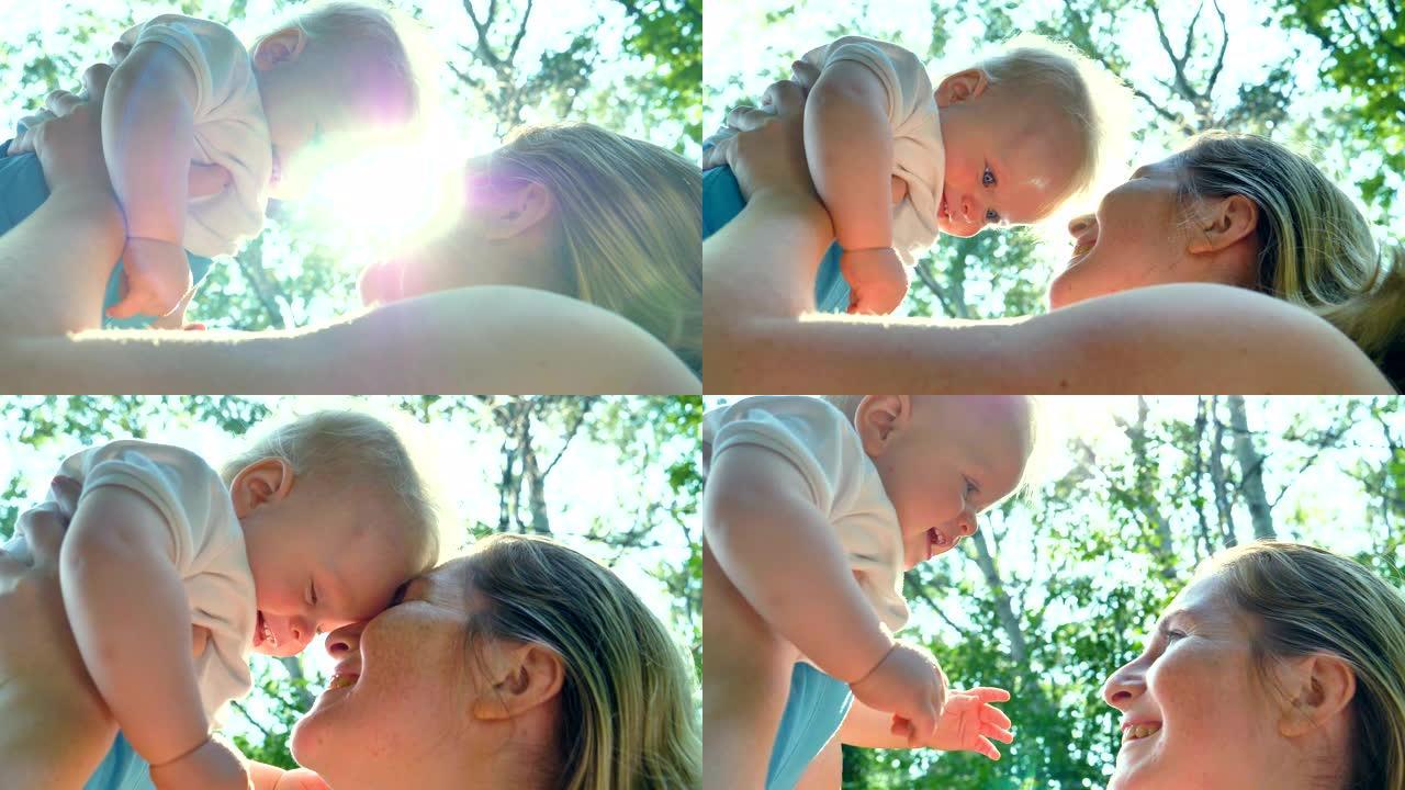 一生中最美好的时刻，一位充满爱心的快乐年轻母亲拥抱着她的孩子。爱情、家庭和幸福的概念。